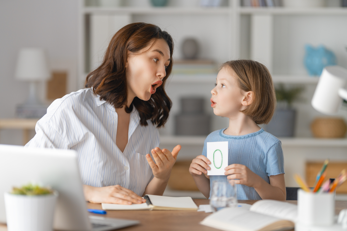 Image of therapist supervising an autistic child.